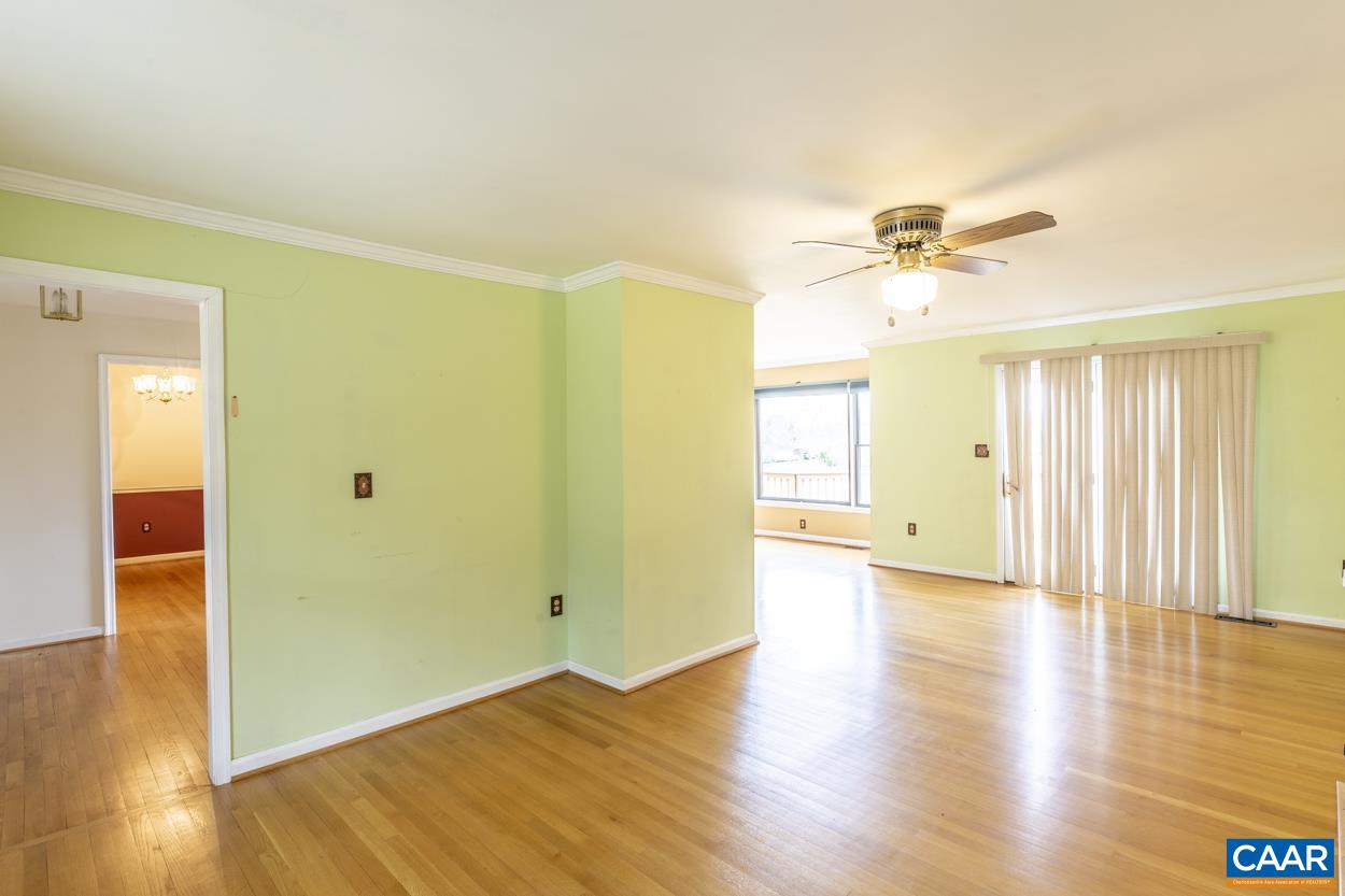 2011 Wilderness Road Reva, VA 22735 - Photo 23 of 75 a view of a livingroom with wooden floor and a ceiling fan
