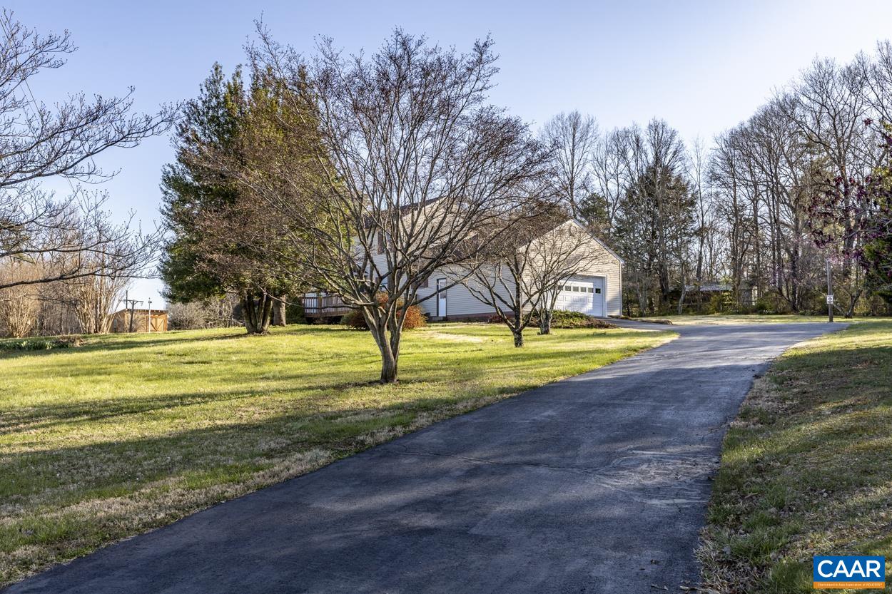 2011 Wilderness Road Reva, VA 22735 - Photo 3 of 75 a view of a house with a big yard and large trees