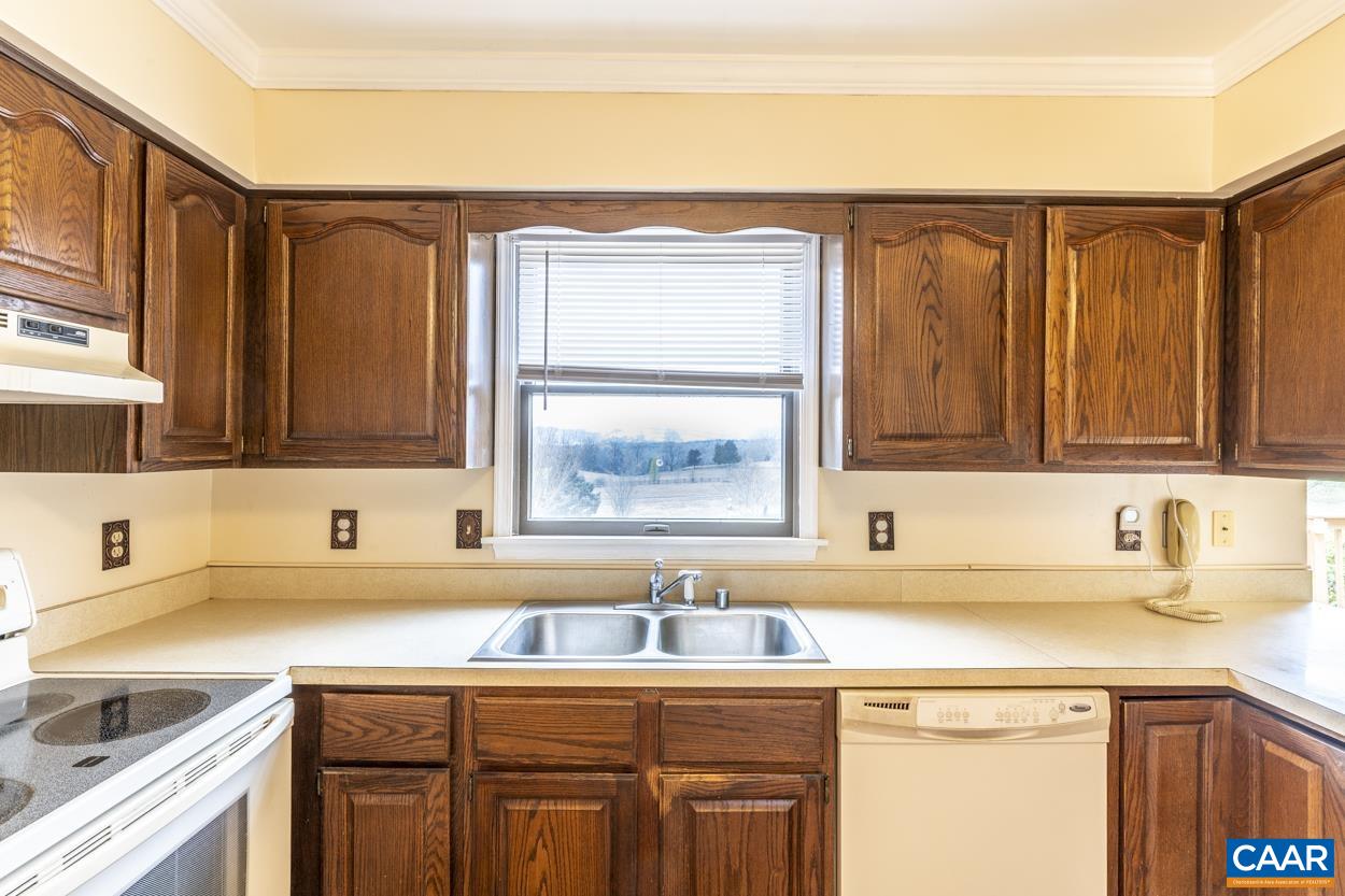2011 Wilderness Road Reva, VA 22735 - Photo 35 of 75 a kitchen with a sink cabinets and a window