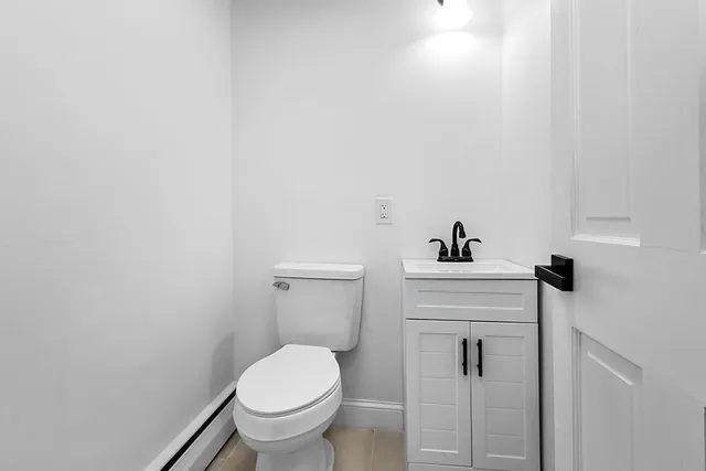 a bathroom with a toilet and a sink