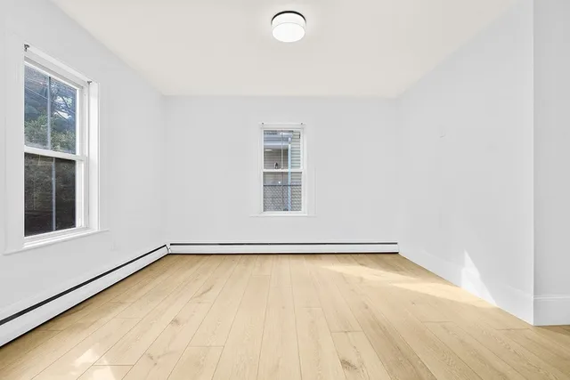 a view of a room with a large window