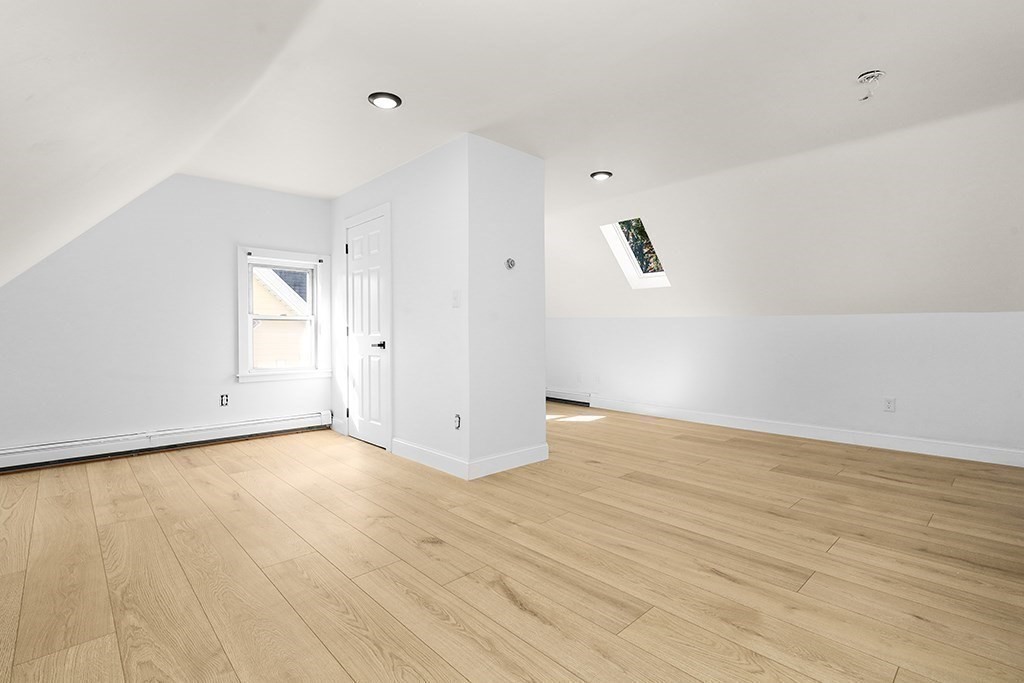 27 Ladd Street, Unit 27 Watertown, MA 02472 - Photo 8 of 10 a view of an empty room with wooden floor
