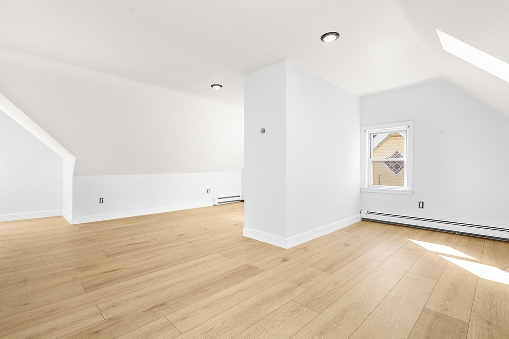 27 Ladd Street, Unit 27 Watertown, MA 02472 - Photo 9 of 10 a view of an empty room and wooden floor