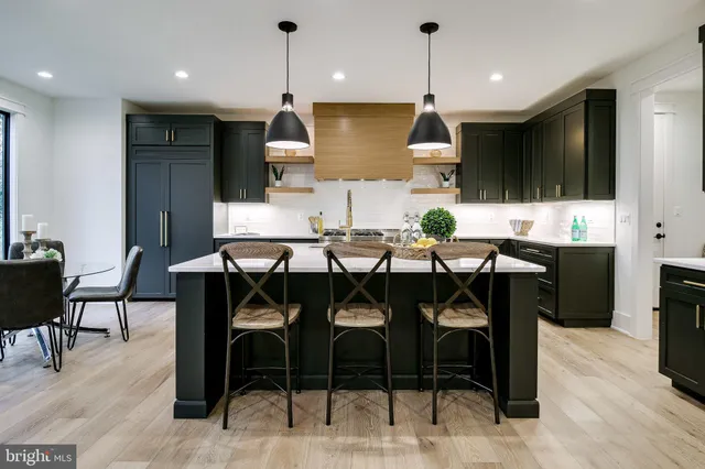 a spacious bathroom with a double vanity sink a mirror and shower