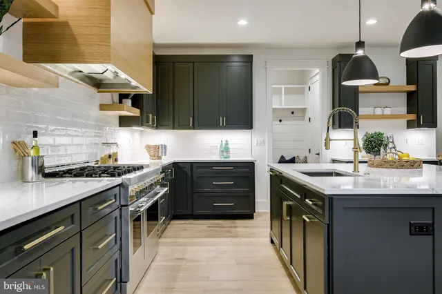a spacious bathroom with a double vanity sink a mirror and a bathtub