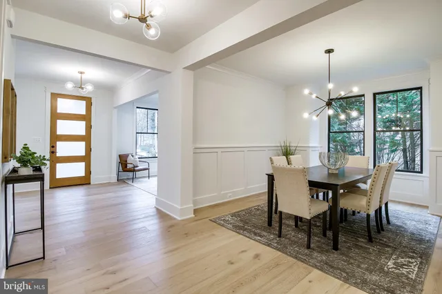 a living room with furniture flat screen tv and a fireplace
