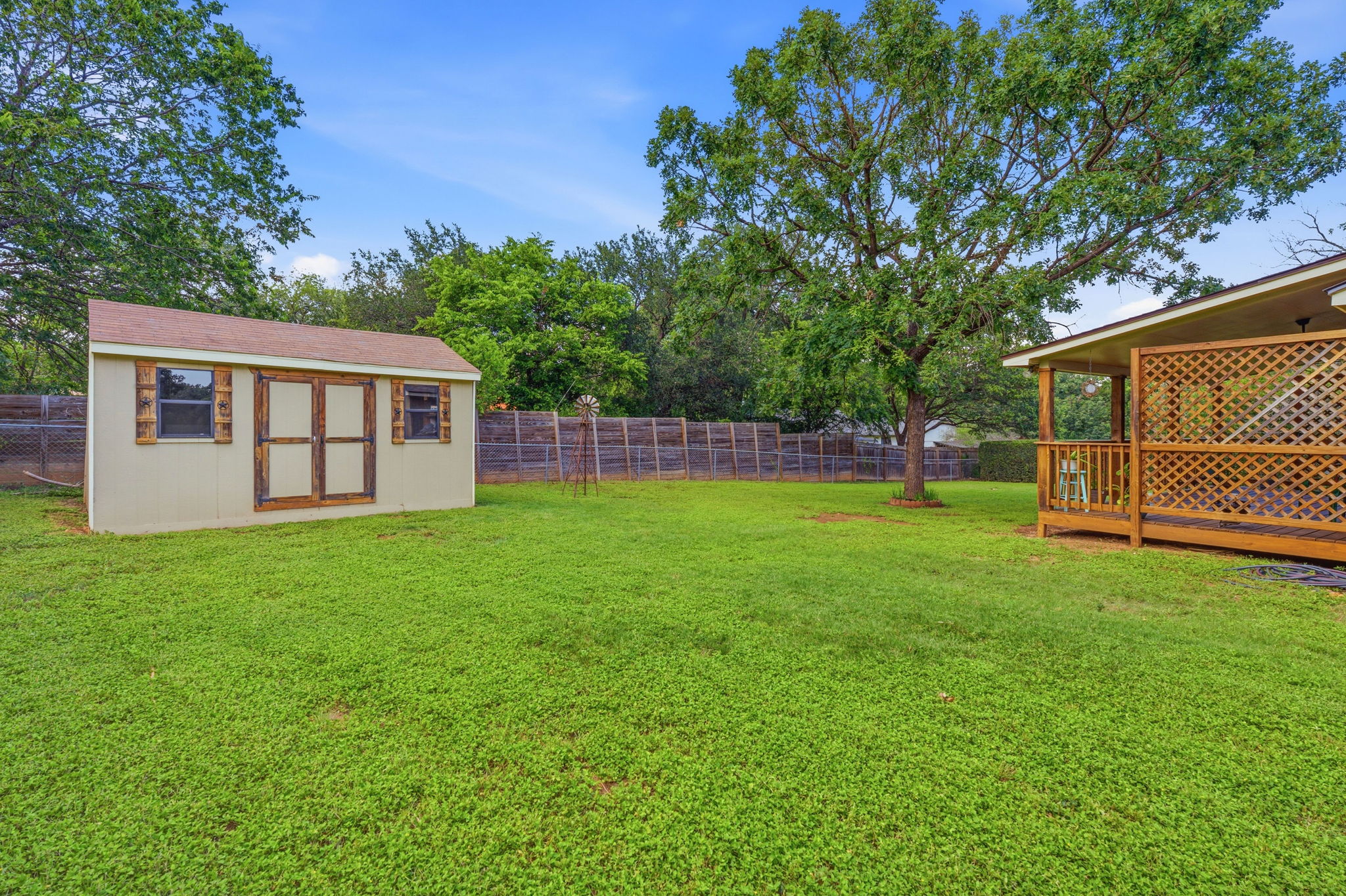 2702 Calabash Cove Austin, TX 78745 - Photo 34 of 40 a view of a house with backyard and a tree