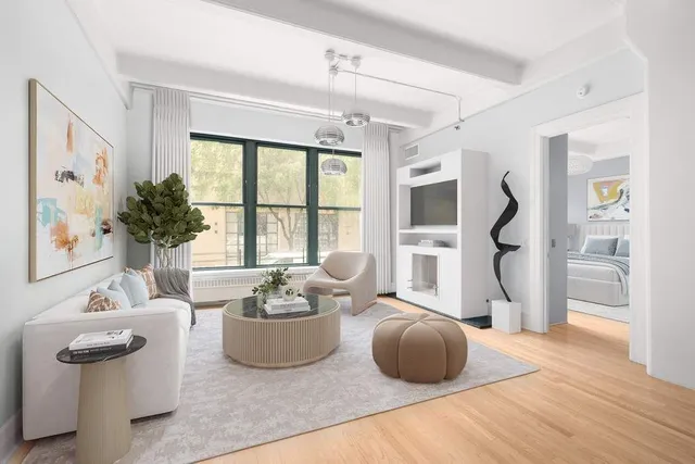 a living room with furniture and a window