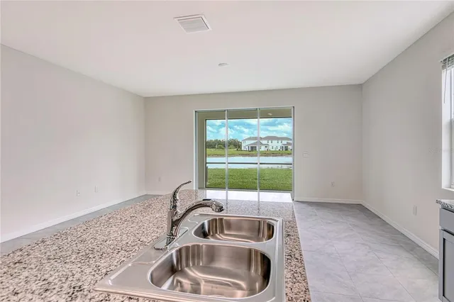 a kitchen with a sink and window