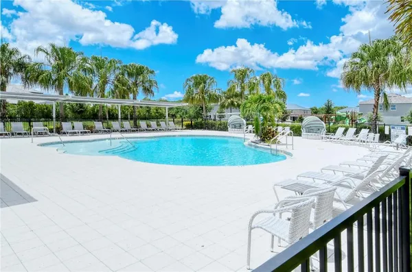 a view of a swimming pool with a yard
