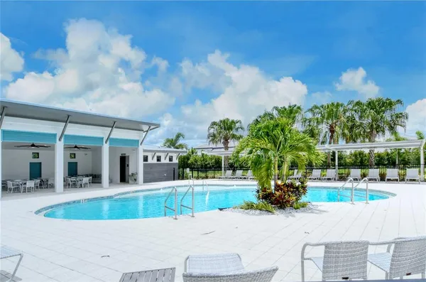 a view of swimming pool with seating space