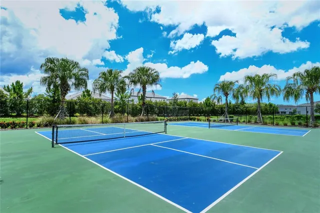 a view of a garden with a house in the background