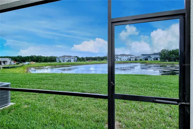 a view of outdoor space with a lake view