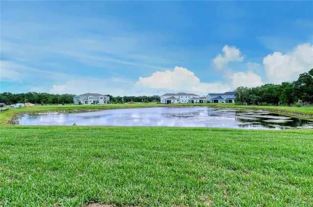 a view of a lake with a big yard
