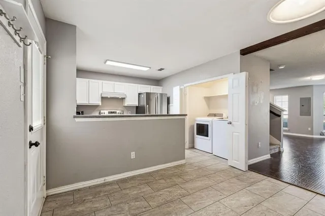 a view of a kitchen with a sink