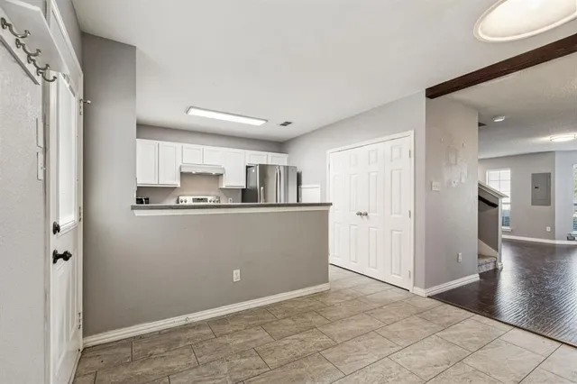 a view of a kitchen from the hallway