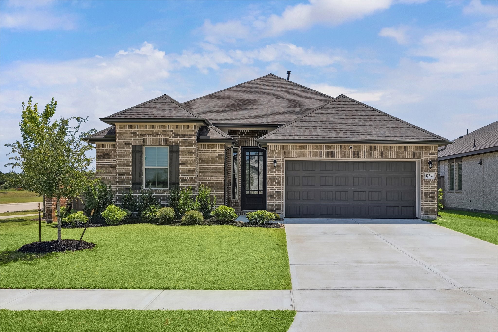 Corner lot with brick noise reduction fence.