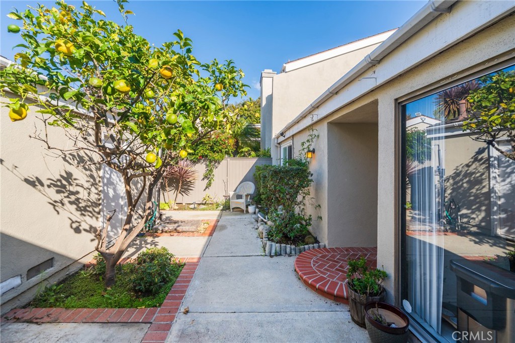19916 Maritime Lane Huntington Beach, CA 92648 - Photo 5 of 43 a front view of a house with a yard