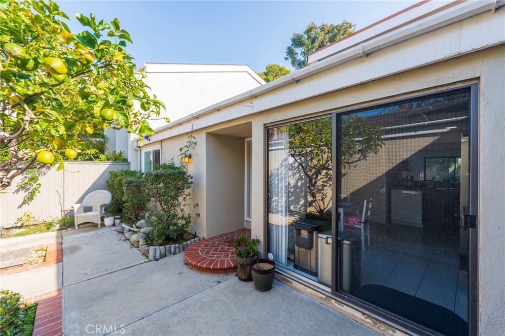 19916 Maritime Lane Huntington Beach, CA 92648 - Photo 6 of 43 a front view of a house with a yard