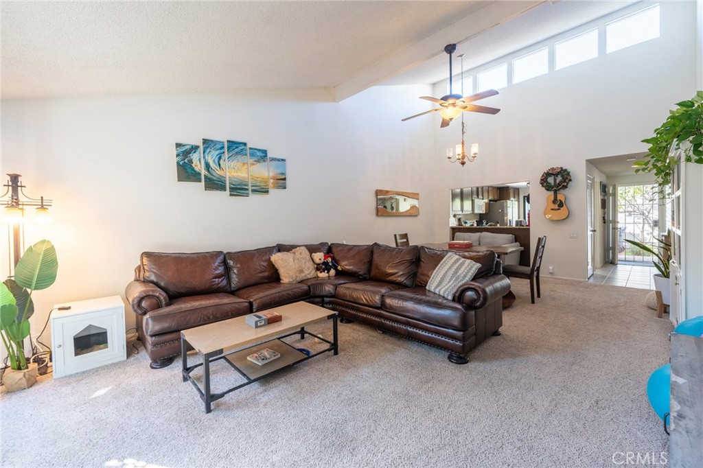 19916 Maritime Lane Huntington Beach, CA 92648 - Photo 9 of 43 a living room with furniture and a chandelier