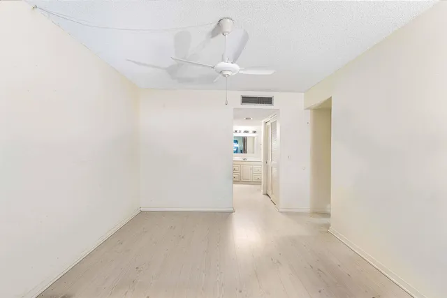 a view of a couches under an umbrella