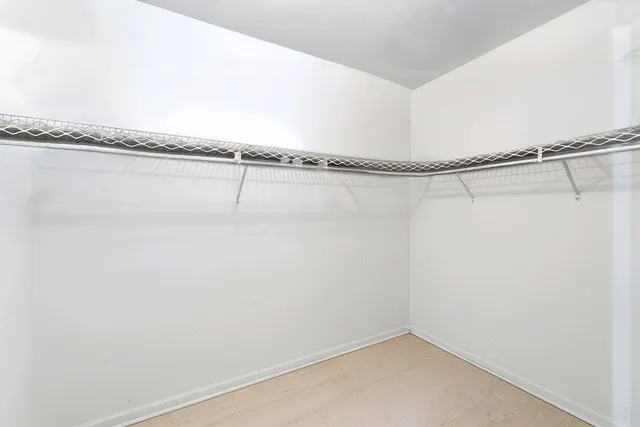 a balcony with furniture and a potted plant