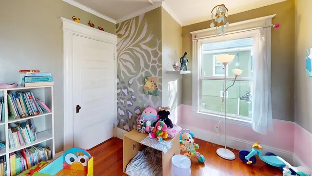 a living room with lots of furniture and a window