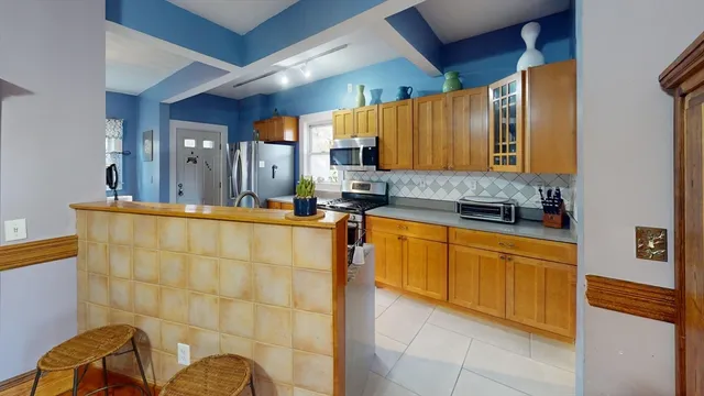 a kitchen with stainless steel appliances granite countertop a sink and cabinets