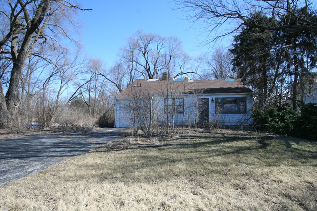 8S139 South Madison Street Burr Ridge, IL 60527 - Photo 1 of 1 a front view of a house with trees