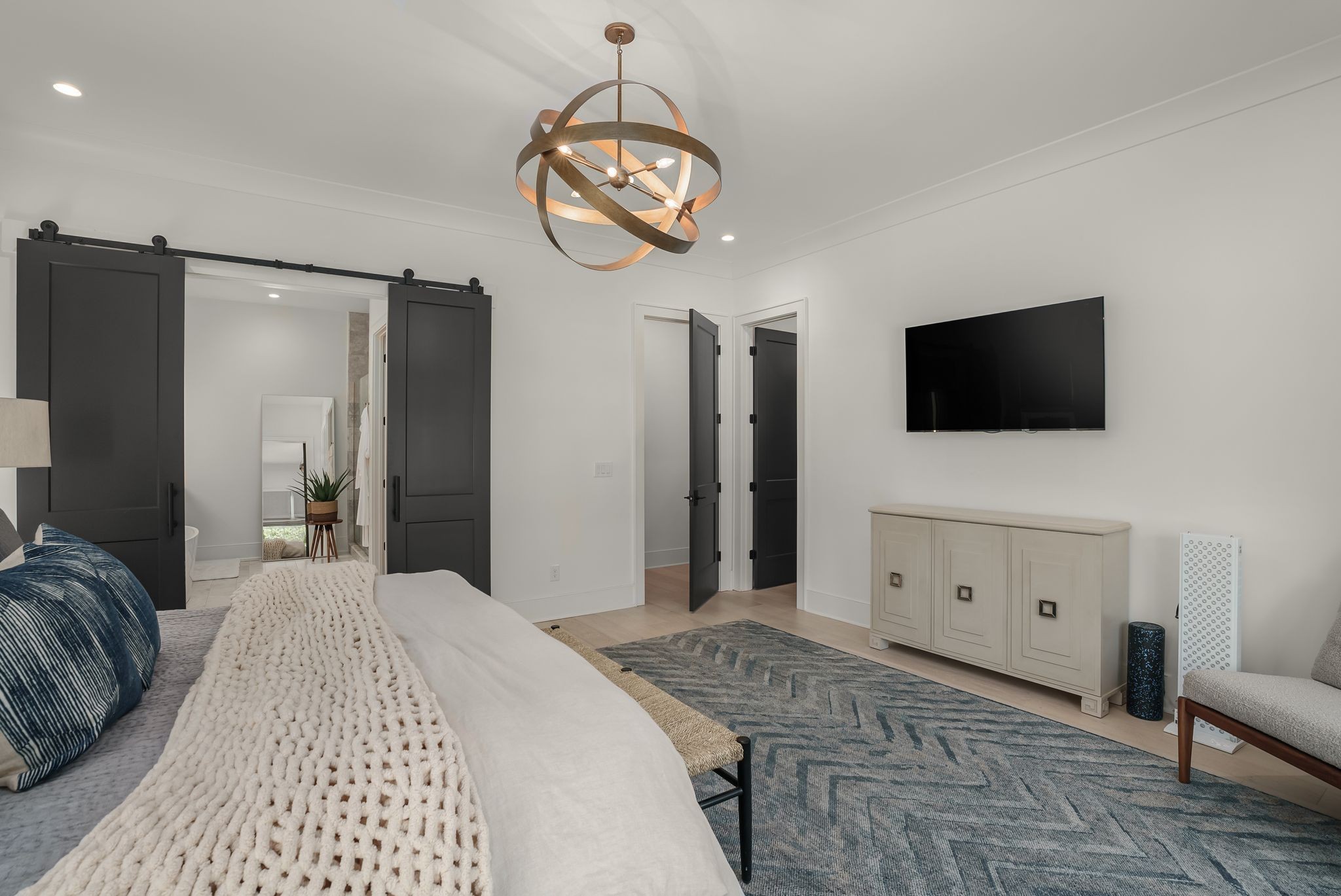 4909 Dakota Avenue Nashville, TN 37209 - Photo 20 of 39 a bedroom with a bed and a flat screen tv