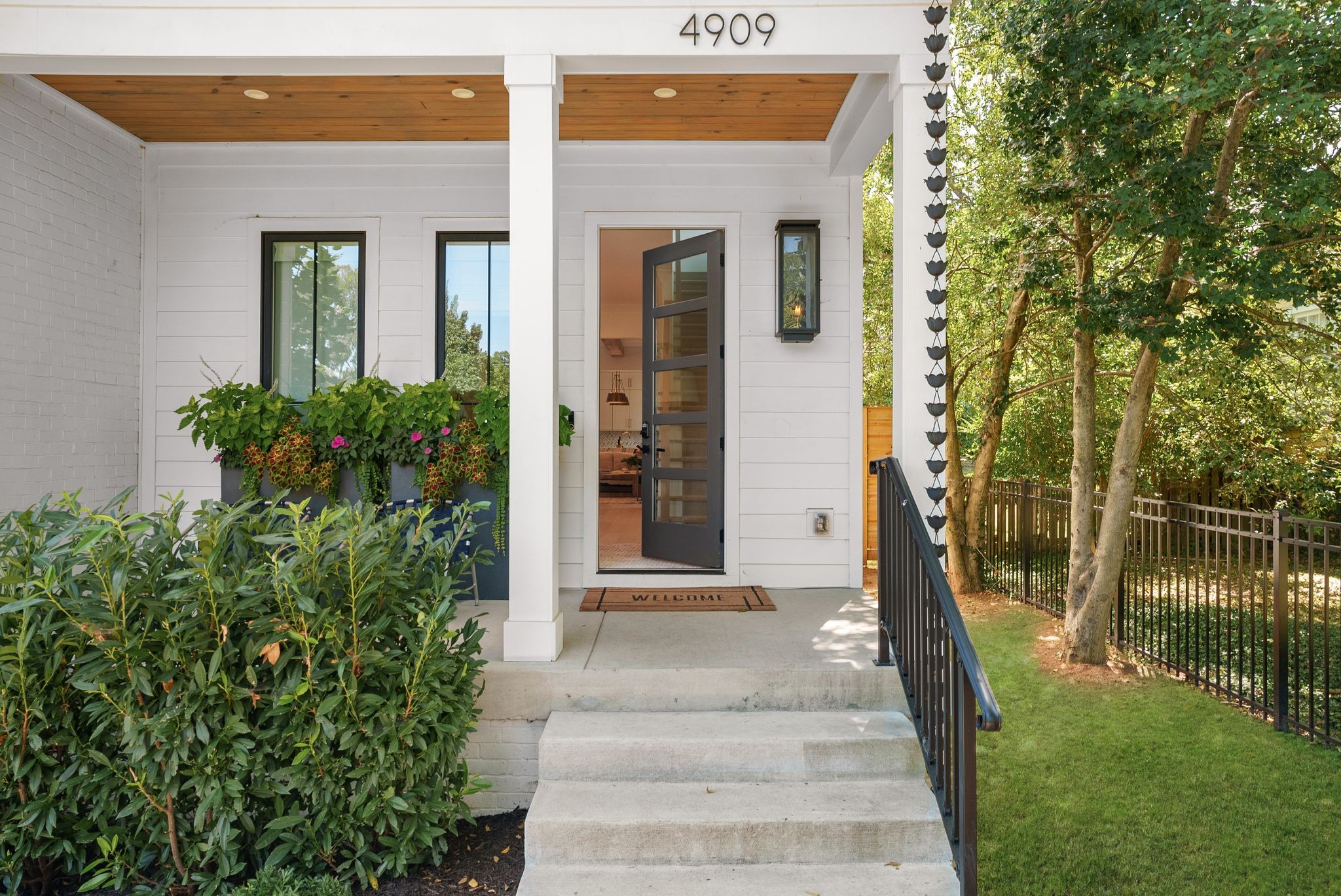 4909 Dakota Avenue Nashville, TN 37209 - Photo 2 of 39 a front view of a house with a garden