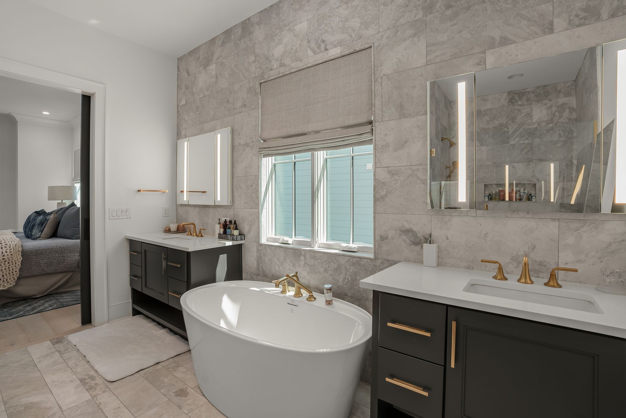 4909 Dakota Avenue Nashville, TN 37209 - Photo 22 of 39 a bathroom with a double vanity sink a mirror a bathtub and window