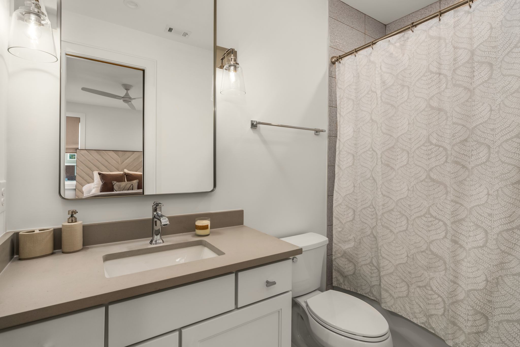 4909 Dakota Avenue Nashville, TN 37209 - Photo 27 of 39 a bathroom with a granite countertop sink toilet a mirror and shower