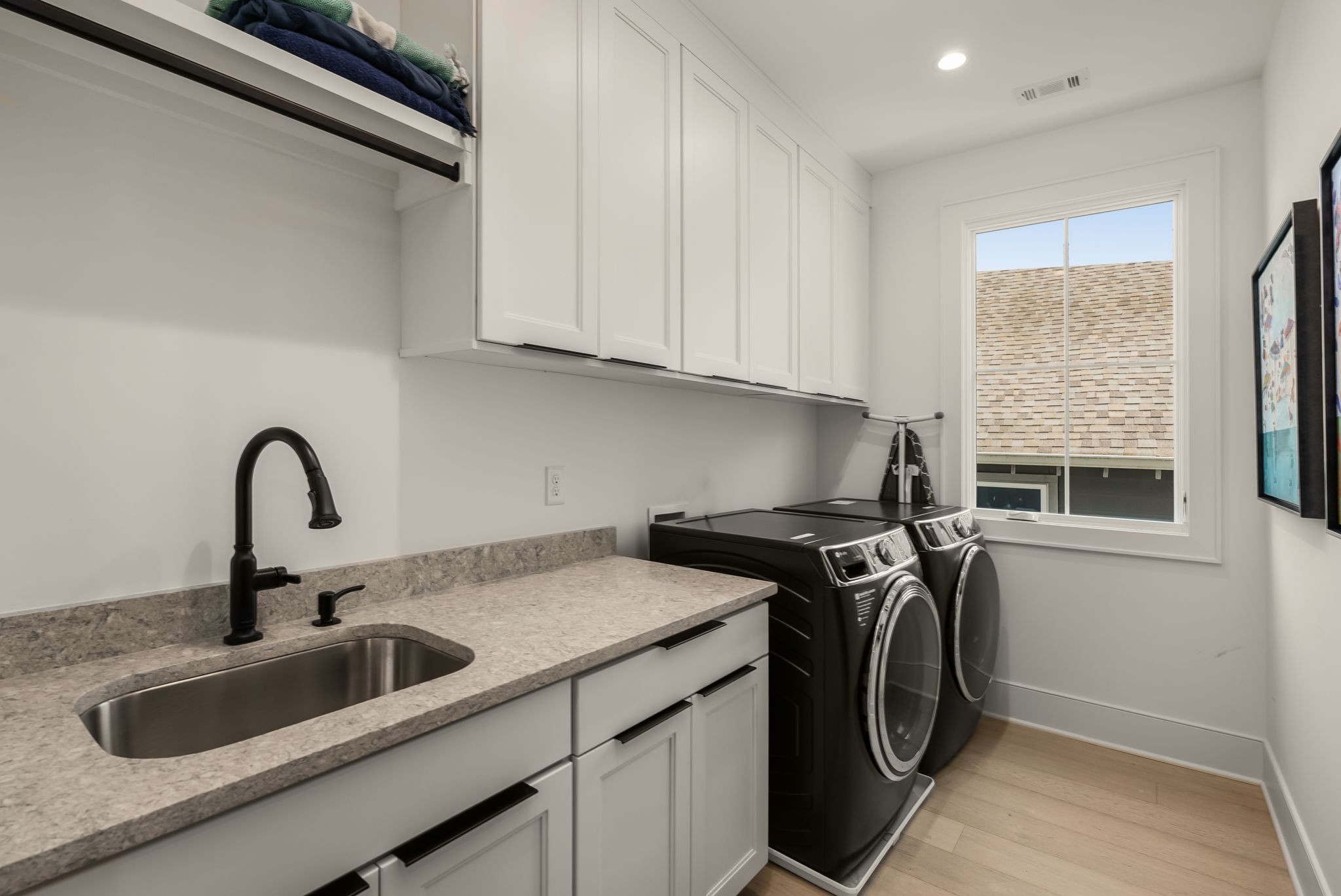 4909 Dakota Avenue Nashville, TN 37209 - Photo 28 of 39 a view of a kitchen with sink washing machine and a window