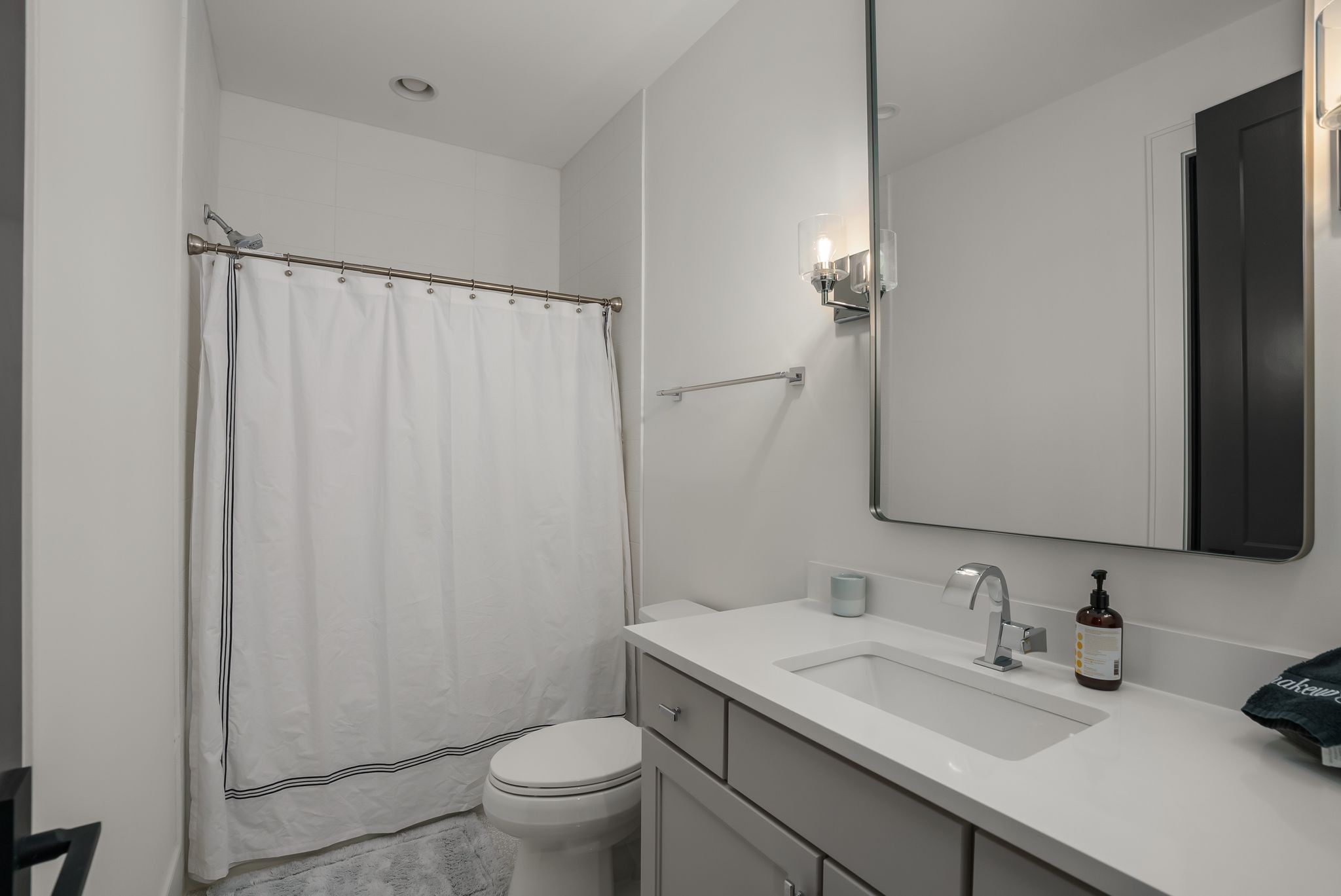 4909 Dakota Avenue Nashville, TN 37209 - Photo 30 of 39 a bathroom with a granite countertop sink toilet and a mirror