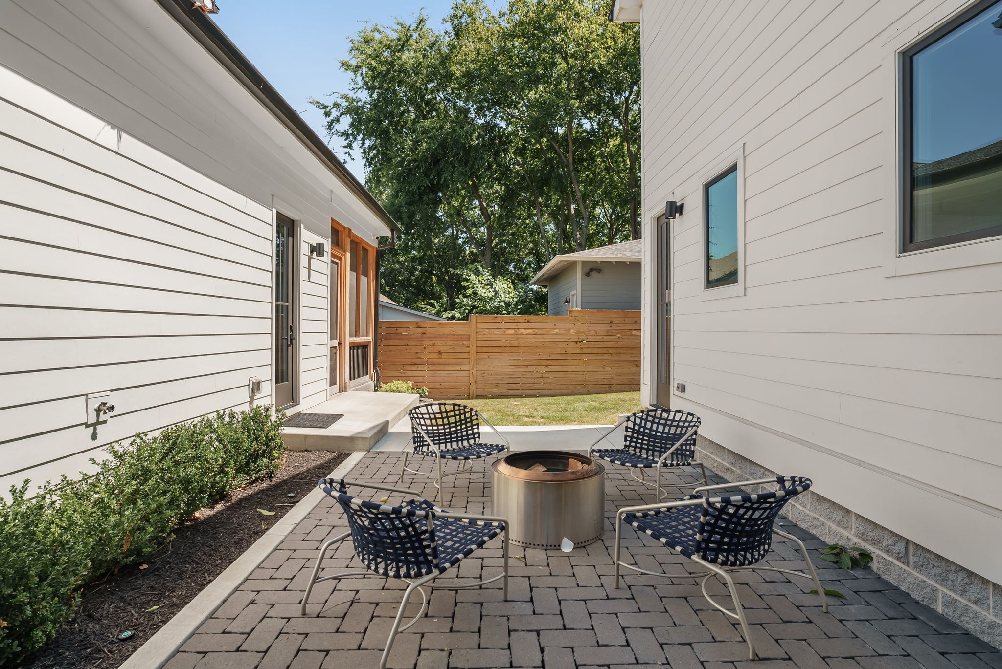 4909 Dakota Avenue Nashville, TN 37209 - Photo 36 of 39 a view of a backyard with chair and potted plants