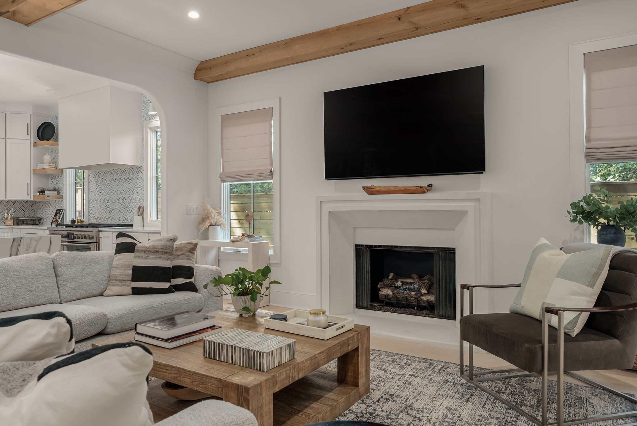 4909 Dakota Avenue Nashville, TN 37209 - Photo 8 of 39 a living room with furniture a flat screen tv and a fireplace