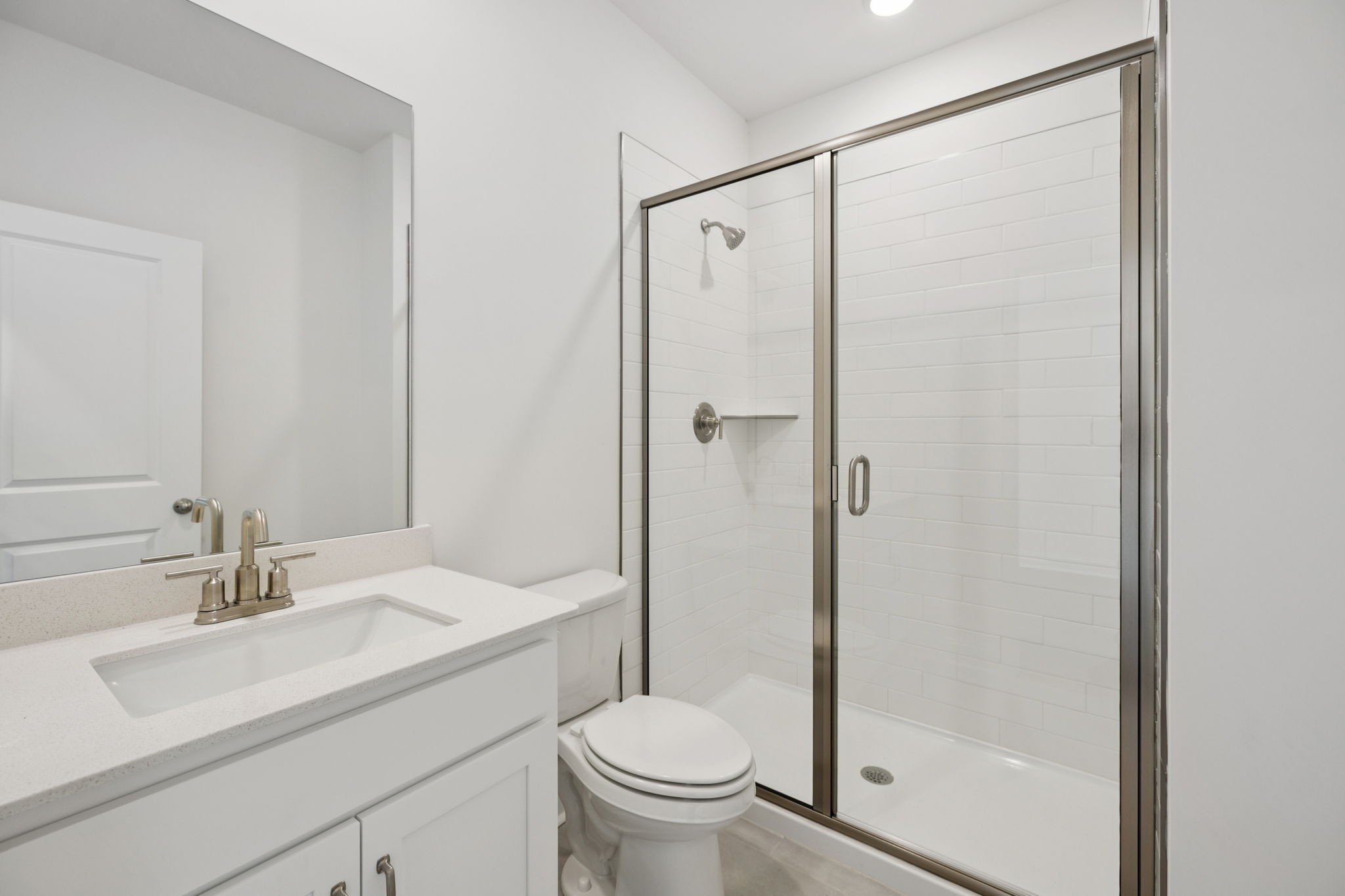 140 Emeline Way Mount Juliet, TN 37122 - Photo 15 of 35 a bathroom with a sink toilet and shower