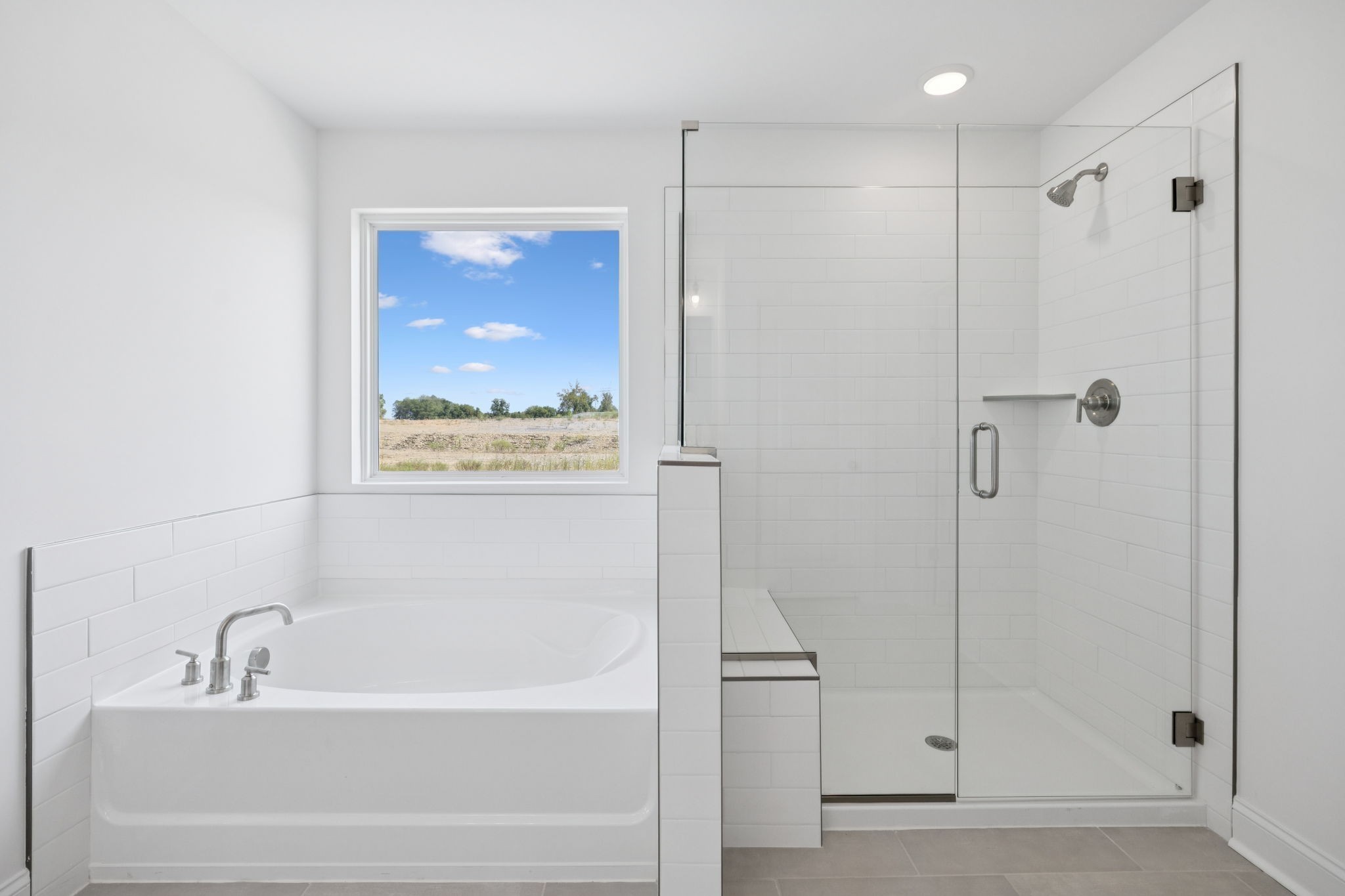 140 Emeline Way Mount Juliet, TN 37122 - Photo 18 of 35 a bathroom with a bathtub and a shower