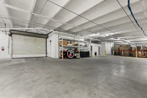 a view of parking garage with cars