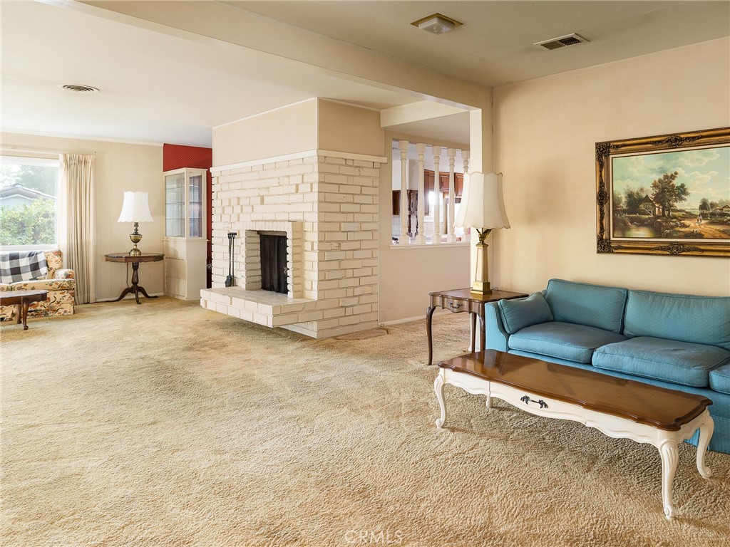 61 Ranchview Road Rolling Hills Estates, CA 90274 - Photo 12 of 44 a living room with furniture and a fireplace