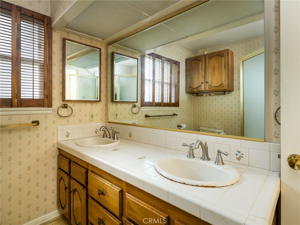 61 Ranchview Road Rolling Hills Estates, CA 90274 - Photo 22 of 44 a bathroom with a sink and a mirror