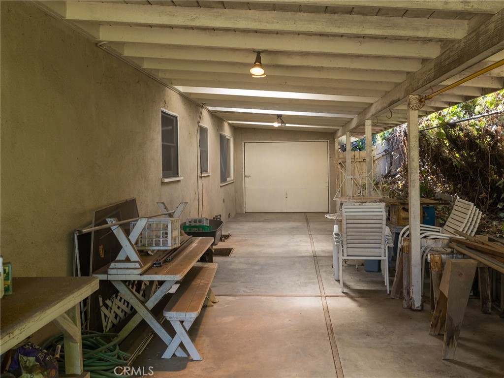61 Ranchview Road Rolling Hills Estates, CA 90274 - Photo 37 of 44 a view of a patio with table and chairs and potted plants