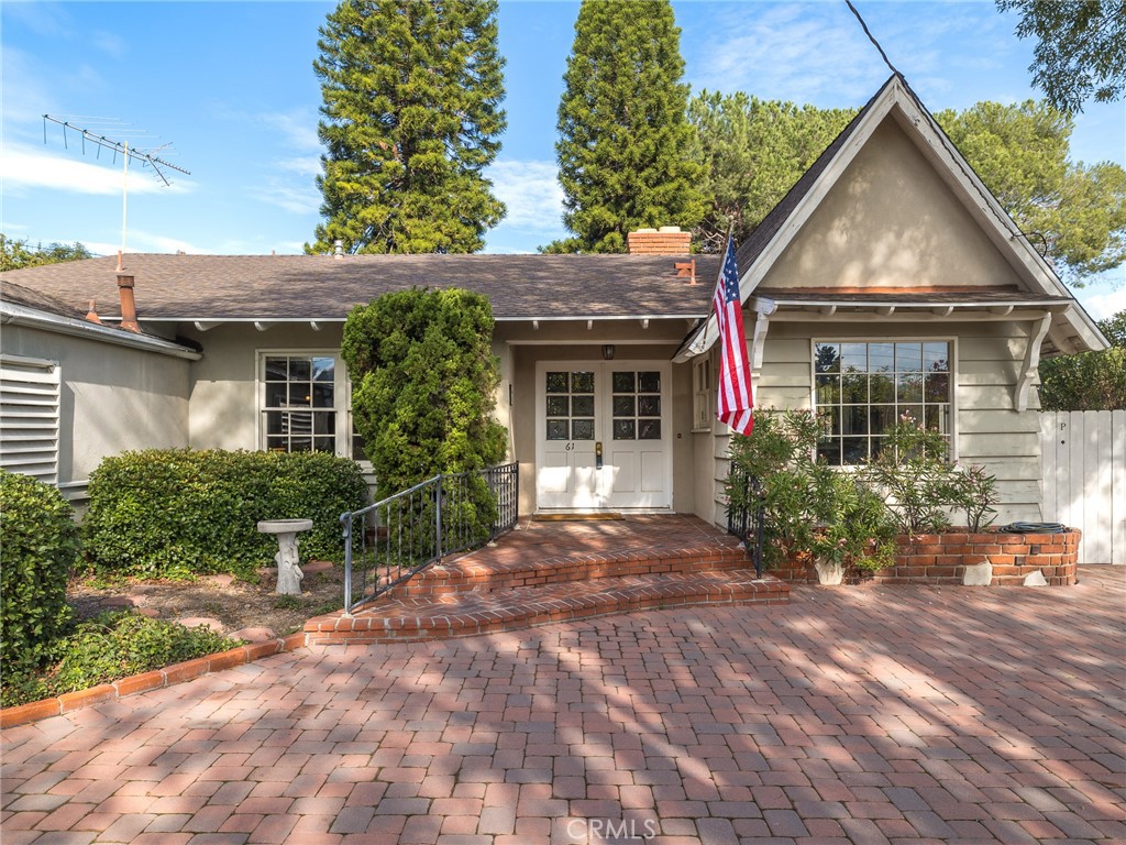 61 Ranchview Road Rolling Hills Estates, CA 90274 - Photo 5 of 44 a front view of a house with a garden