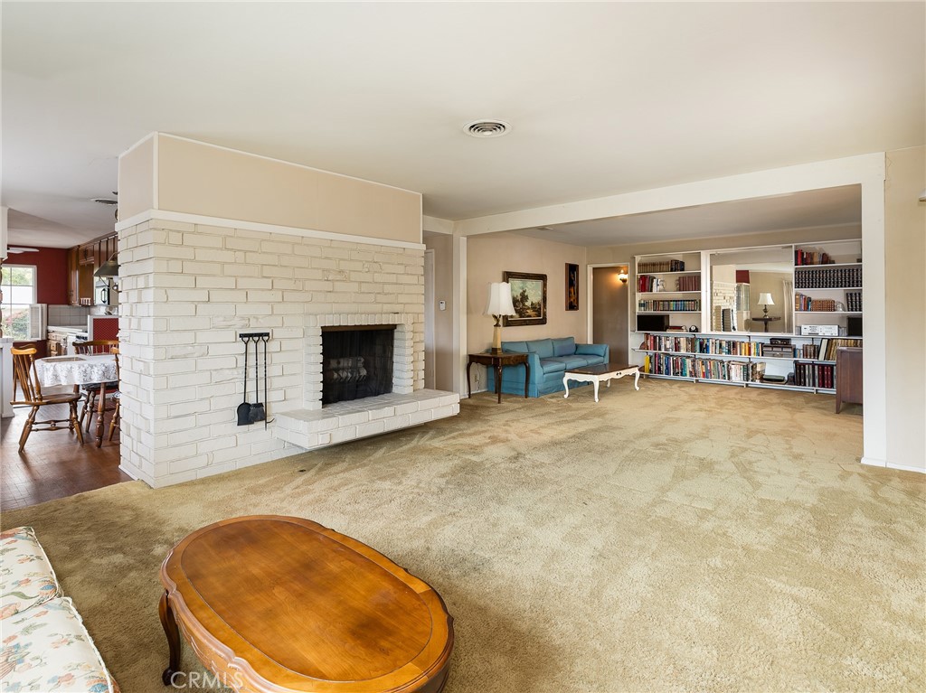 61 Ranchview Road Rolling Hills Estates, CA 90274 - Photo 6 of 44 a living room with furniture and a fireplace