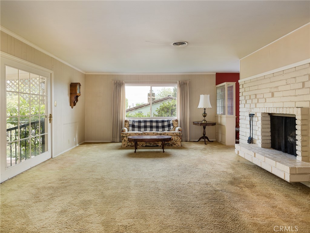 61 Ranchview Road Rolling Hills Estates, CA 90274 - Photo 7 of 44 a living room with furniture and a fireplace