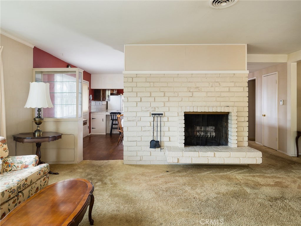 61 Ranchview Road Rolling Hills Estates, CA 90274 - Photo 8 of 44 a living room with furniture and a fireplace