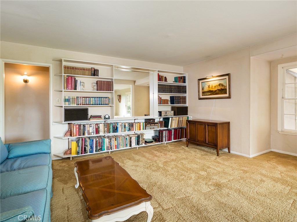 61 Ranchview Road Rolling Hills Estates, CA 90274 - Photo 9 of 44 a living room with furniture cabinets and a book shelf