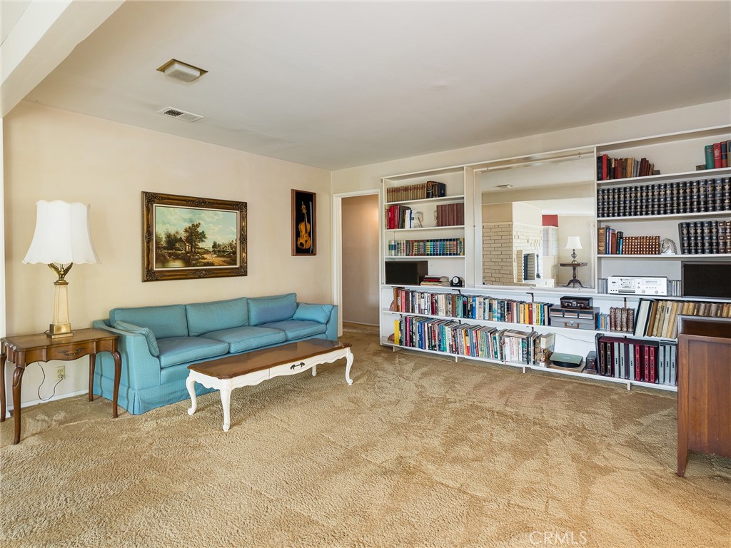 61 Ranchview Road Rolling Hills Estates, CA 90274 - Photo 10 of 44 a room with furniture and a book shelf