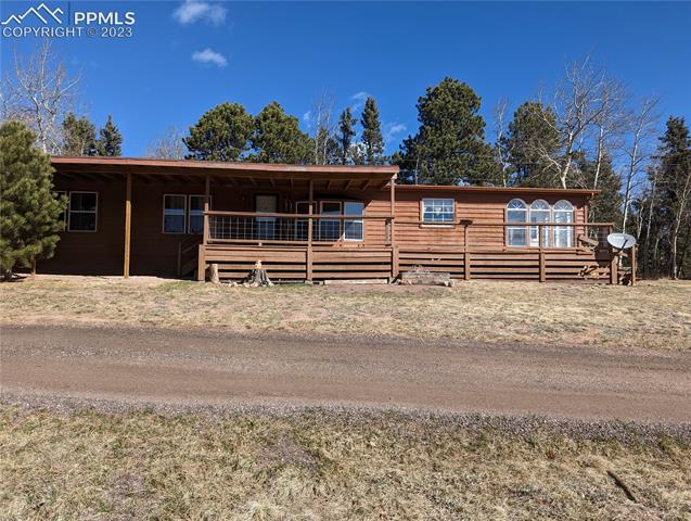 152 Ridge Road Divide, CO 80814 - Photo 3 of 9 Guest house, with covered carport and deck.